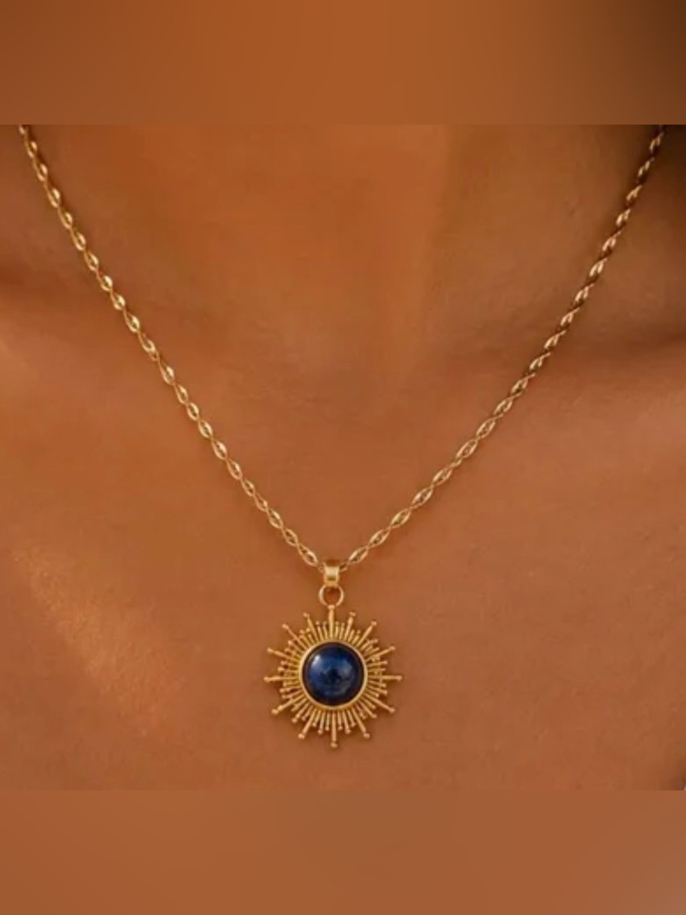 Gold Tone Sunburst Pendant Necklace with Blue Stone